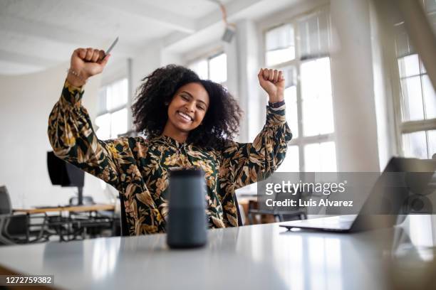 woman feeling excited with online shopping experience - excitement stock pictures, royalty-free photos & images
