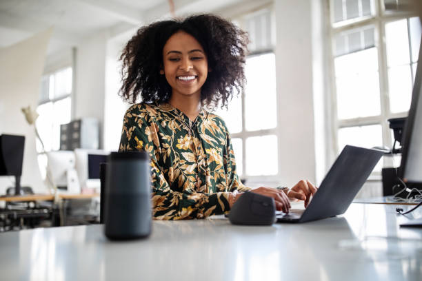 How to Make R1000 a Day in South Africa? 25 Proven Ways 4 woman using smart speaker while working in office