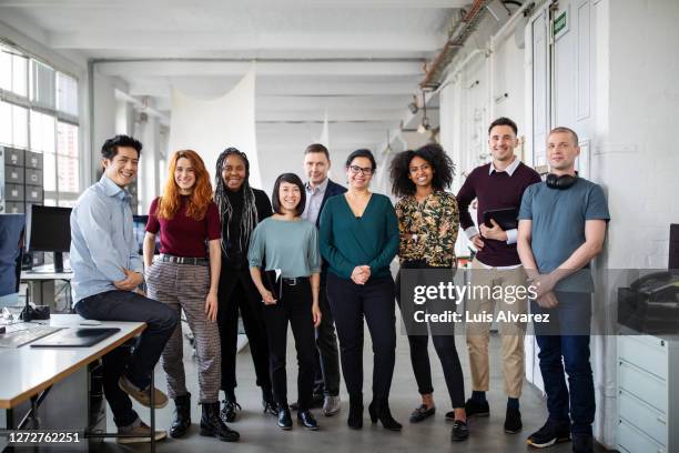 multiracial business group in office - creative collaboration holding stockfoto's en -beelden