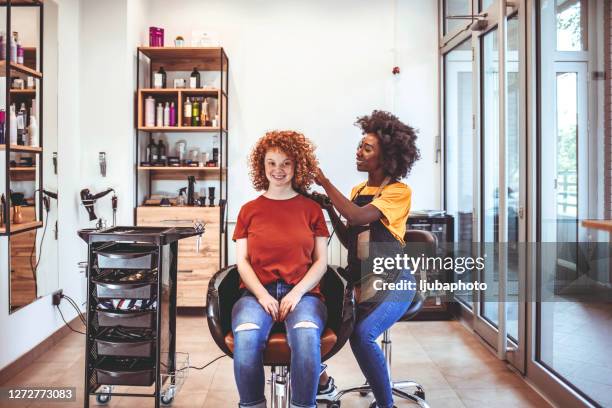your hairstyle should match your persona - african american hair salon stock pictures, royalty-free photos & images