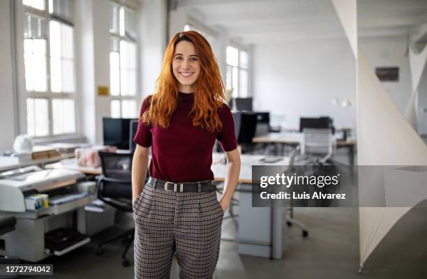 portrait of a confident businesswoman - redhead fotografías e imágenes de stock