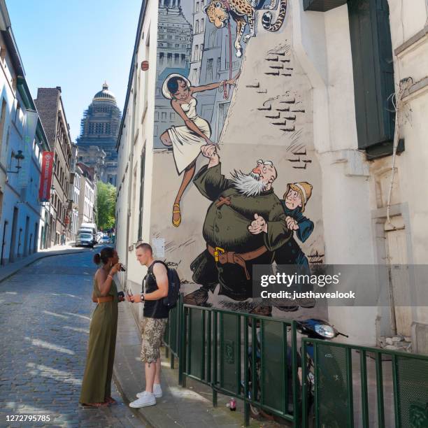 caucasian man and black woman in brussels - brussels summer stock pictures, royalty-free photos & images