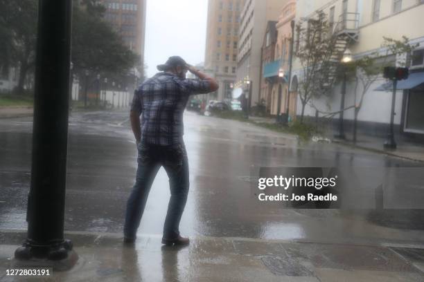 Steven Jagnandan braces himself against the winds and rain from Hurricane Sally as it passes through the area on September 16, 2020 in Mobile,...