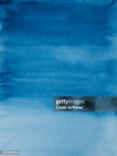 abstract watercolor background painting in blue tones - blue watercolor stock-fotos und bilder