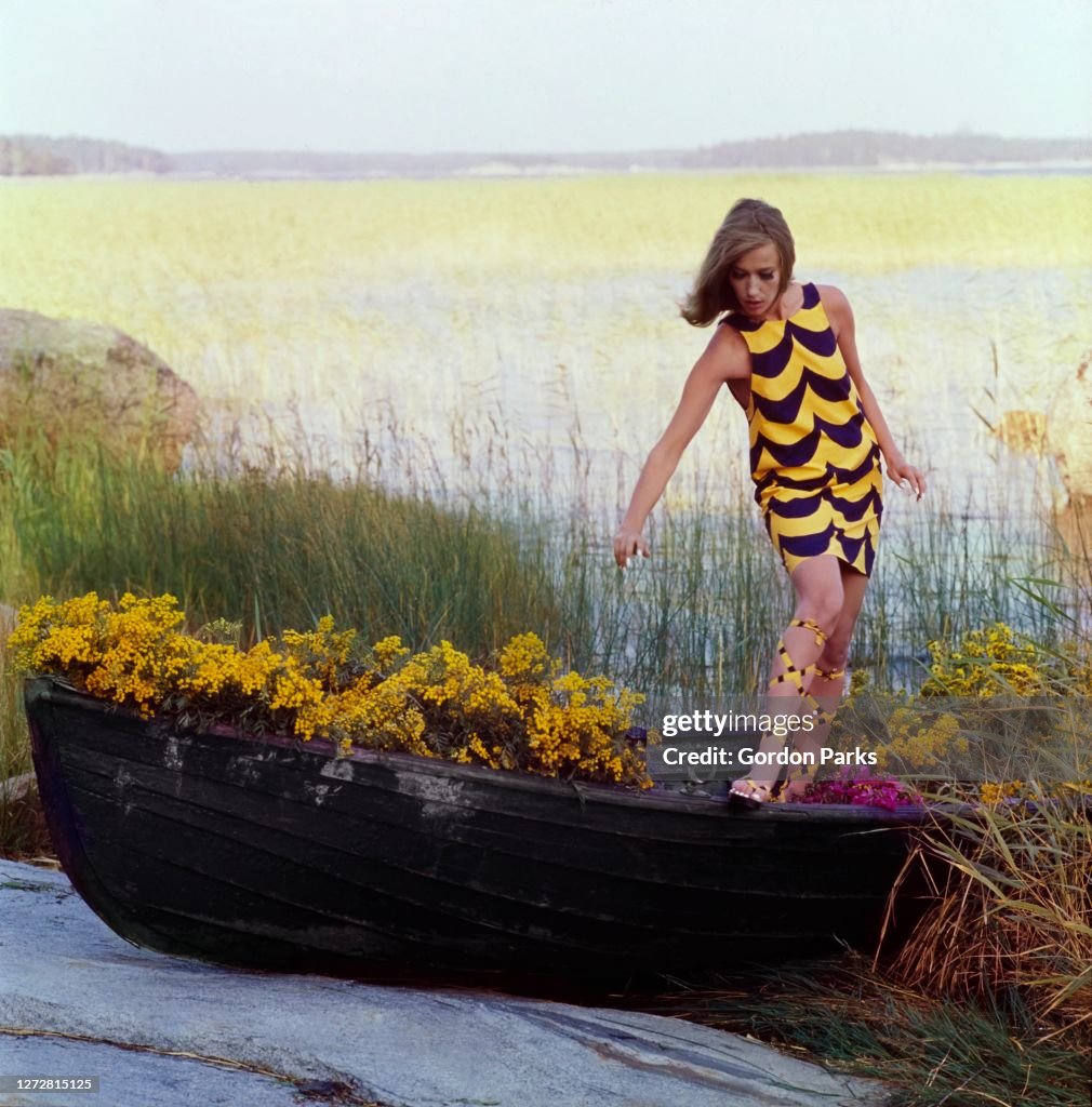 Model in a Wave-Printed Sleeveless Dress, Vogue