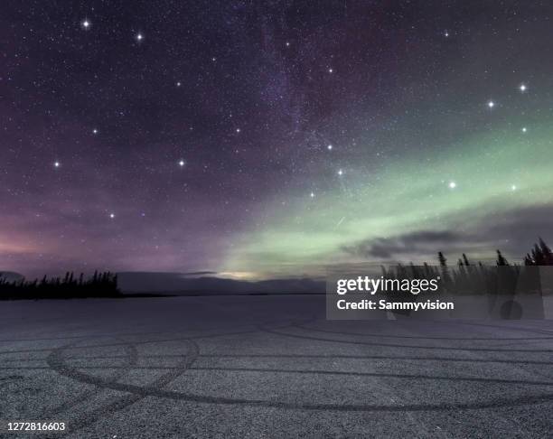 road against northern light in winter - murmansk stock pictures, royalty-free photos & images