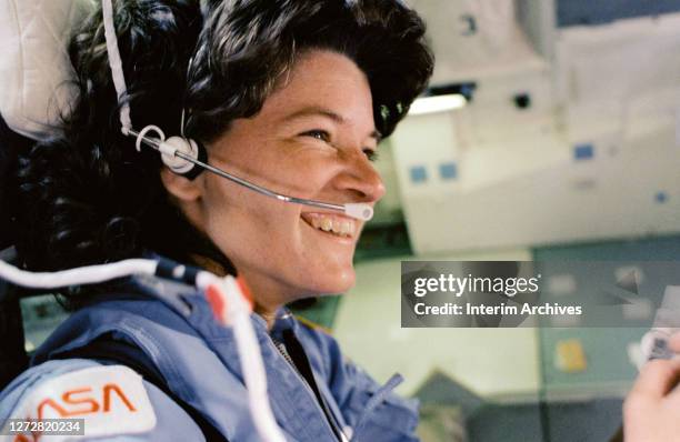 American astronaut and scientist Sally Ride, as STS-7 mission specialist, is pictured in the aft flight deck seat of the space shuttle Challenger...