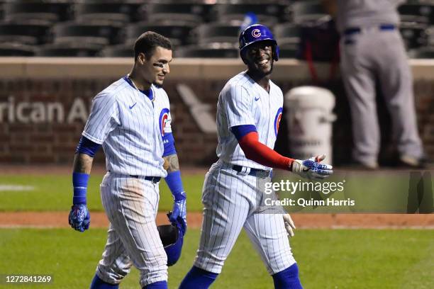 Cameron Maybin and Javier Baez of the Chicago Cubs celebrate after the win against Cleveland Indians at Wrigley Field on September 15, 2020 in...