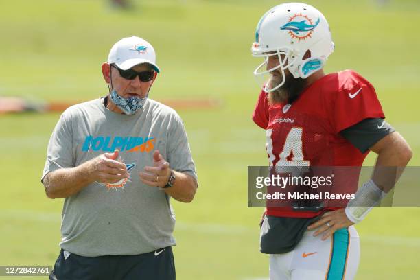 Offensive coordinator Chan Gailey of the Miami Dolphins talks with Ryan Fitzpatrick during practice at Baptist Health Training Facility at Nova...