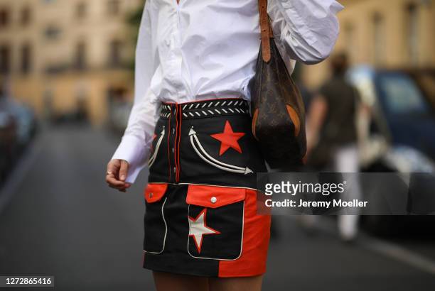 Lea Neumann wearing white shirt, leather vintage skirt and Louis Vuitton bag on September 12, 2020 in Berlin, Germany.