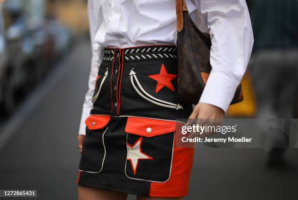 Lea Neumann wearing white shirt, leather vintage skirt and Louis Vuitton bag on September 12, 2020 in Berlin, Germany.