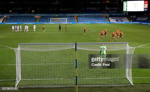 Kiko Casilla of Leeds United looks dejected as Hull City players celebrate winning the penalty shoot out during the Carabao Cup Second Round match...