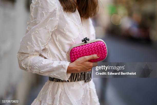 Therese Hellström wears a white gathered/pleated dress with embroidery and shoulder pads from H&M, a large black and white zebra print pattern belt,...