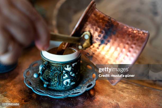 turkish coffees are cooking on embers - turkish coffee stock pictures, royalty-free photos & images