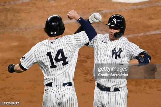 Kyle Higashioka of the New York Yankees celebrates with Tyler Wade after Higashioka hit a two-run home run during the third inning against the...
