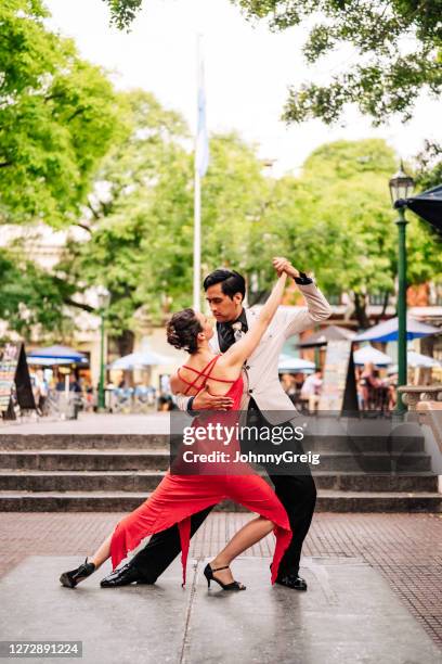 young professionals end their tango in plaza dorrego - argentina tango stock pictures, royalty-free photos & images