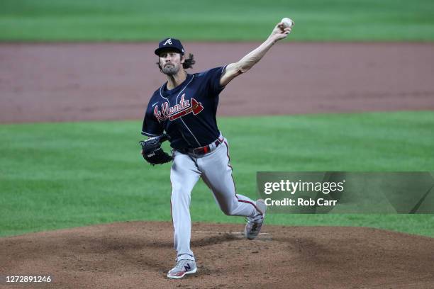Starting pitcher Cole Hamels of the Atlanta Braves throws to a Baltimore Orioles batter in the first inning at Oriole Park at Camden Yards on...