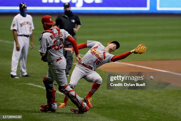 Brad Miller of the St. Louis Cardinals fails to catch a pop fly in the first inning against the Milwaukee Brewers during game two of a doubleheader...