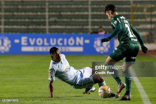 Raphael Veiga of Palmeiras fights for the ball with Cristhian Machado Pinto of Bolivar during a group B match of Copa CONMEBOL Libertadores 2020...