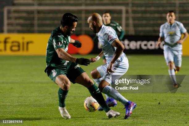 Marcos Daniel Riquelme of Bolivar fights for the ball with Luan of Palmeiras during a group B match of Copa CONMEBOL Libertadores 2020 between...