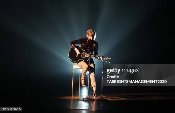 Taylor Swift performs onstage during the 55th Academy of Country Music Awards at the Grand Ole Opry in Nashville, Tennessee. The ACM Awards airs on...