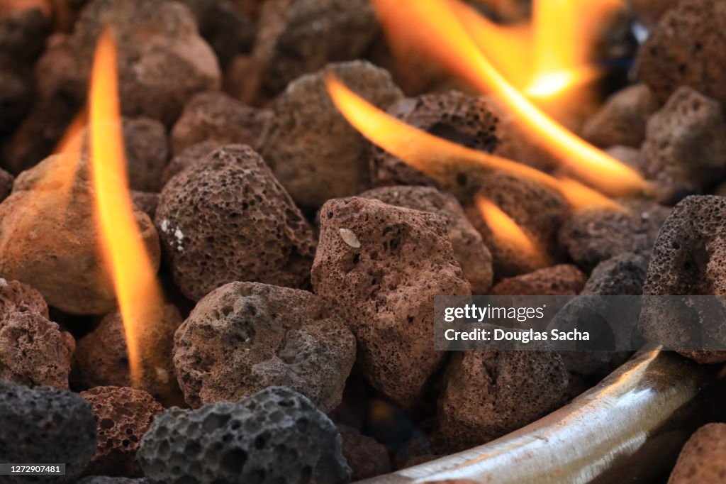 Natural Rocks Inside Fire Natural Gas Fire Pit With Volcanic Rocks High-Res Stock Photo - Getty ...