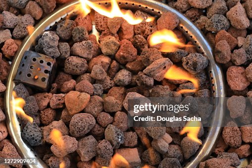 Natural Rocks Inside Fire Natural Gas Fire Pit With Volcanic Rocks High-Res Stock Photo - Getty ...