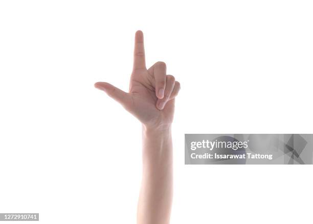 hand shows number one isolated. counting gesturing, enumeration, thumb and index finger open, arms raised white background - daumen drücken stock-fotos und bilder