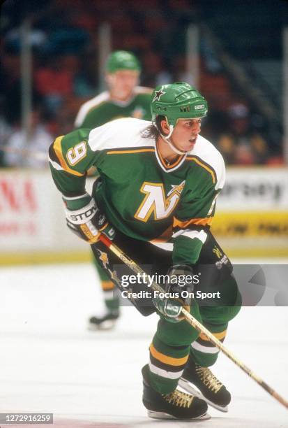 Mike Modano of the Minnesota North Stars skates against New Jersey Devils during an NHL Hockey game circa 1990 at the Brendan Byrne Arena in East...