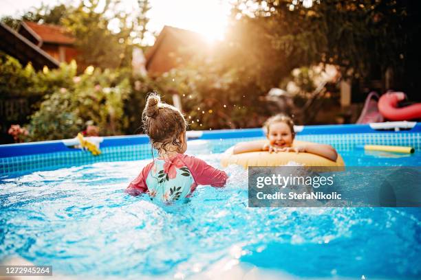 funny summer day - above ground pool stock pictures, royalty-free photos & images