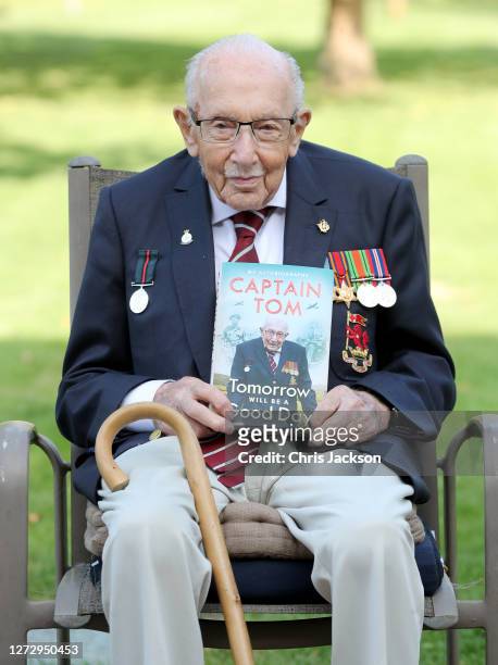 Captain Sir Tom Moore poses during a photocall to mark the launch of his memoir "Tomorrow Will Be A Good Day" at The Coach House on September 17,...