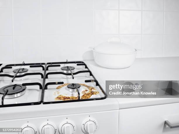 burned milk stain on gas stove - hob stock pictures, royalty-free photos & images