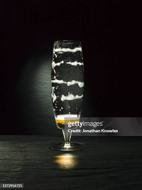 froth stripes in empty beer glass - beer glass stock-fotos und bilder