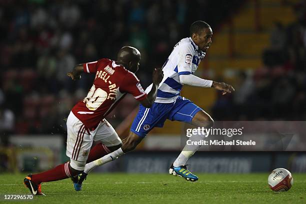 Shaun Cummings of Reading bursts past Jamal Campbell-Ryce during the npower Championship match between Bristol City and Reading at Ashton Gate on...