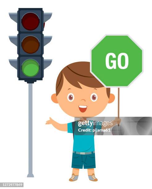 cute boy showing warning road sign, traffic education, rules, safety of kids in traffic - road safety stock illustrations