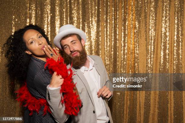 portrait of couple enjoying at party - boa stock pictures, royalty-free photos & images