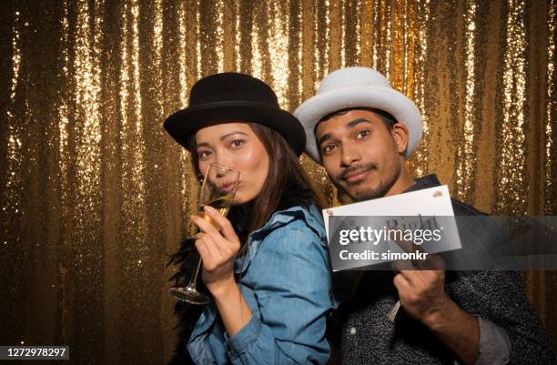 portrait of friends enjoying at party - photo booth couple stock pictures, royalty-free photos & images