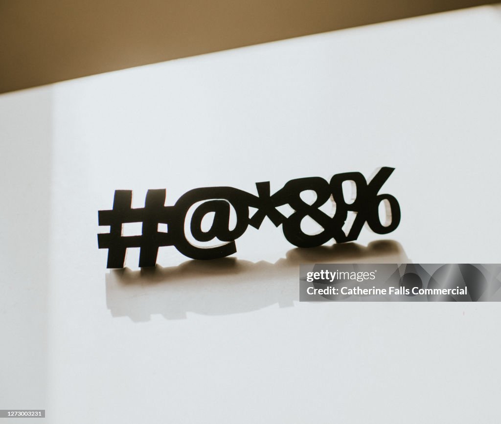 Special Characters casting a Shadow on a White Surface, with Space for copy.