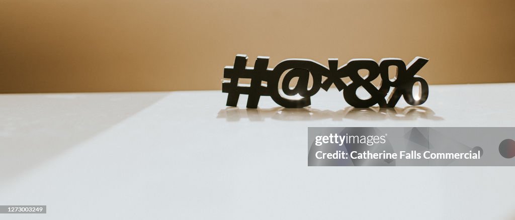 Special Characters casting a Shadow on a White Surface, with Space for copy.