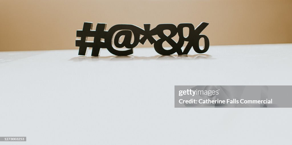 Special Characters casting a Shadow on a White Surface, with Space for copy.
