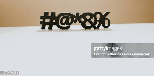 special characters casting a shadow on a white surface, with space for copy. - password strength stock pictures, royalty-free photos & images