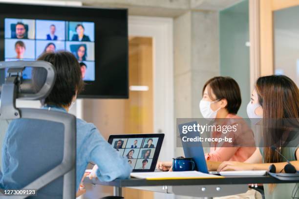 group of diverse business people doing global business meeting via video conference call - covid-19 business meeting stock pictures, royalty-free photos & images