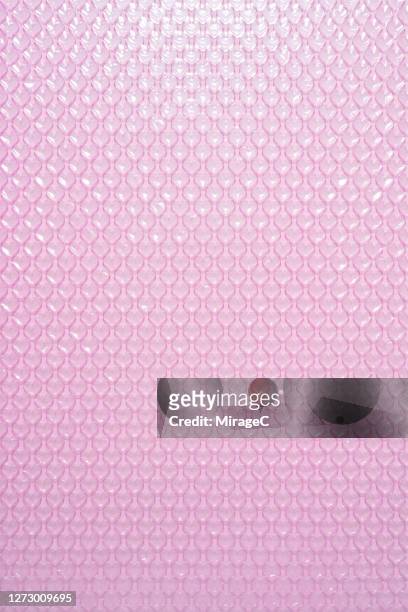 pink heart shape bubble wrap texture - bubble wrap stock pictures, royalty-free photos & images