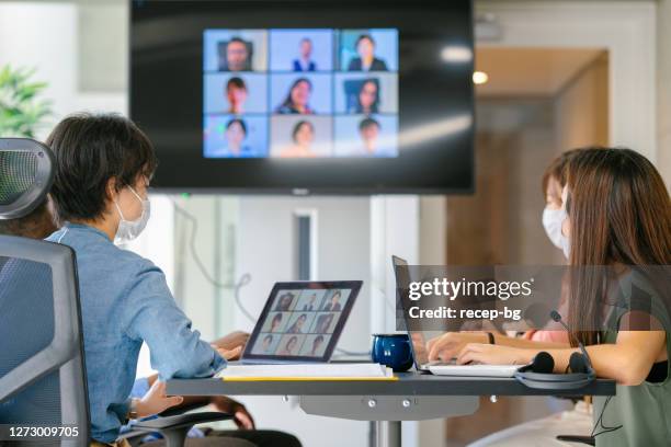 group of diverse business people doing global business meeting via video conference call - business meeting covid stock pictures, royalty-free photos & images