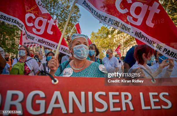 Hospital workers demonstrate in Paris during a day of strikes throughout France called by seven French Unions demanding a new social settlement...