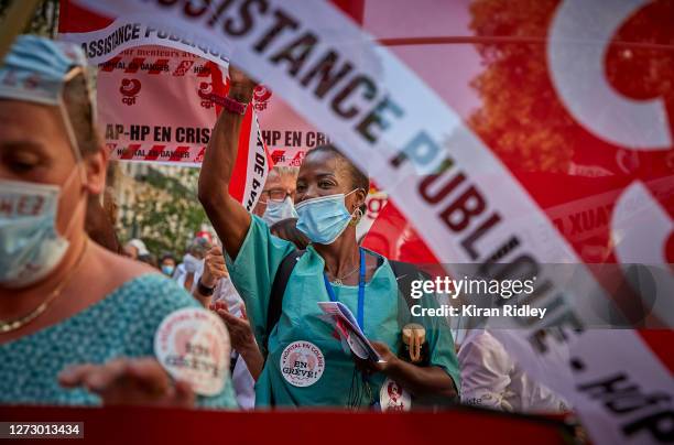 Hospital workers demonstrate in Paris during a day of strikes throughout France, called by seven French Unions, demanding a new social settlement due...