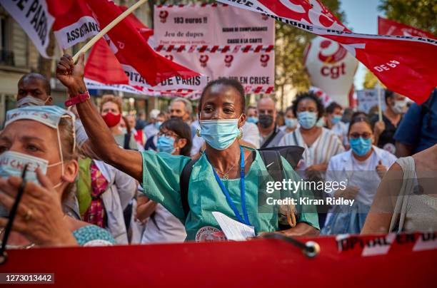 Hospital workers demonstrate in Paris during a day of strikes throughout France, called by seven French Unions, demanding a new social settlement due...