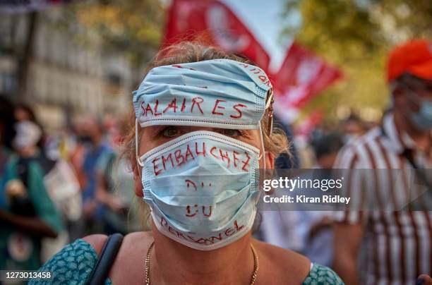 Hospital worker demonstrates during a protest in Paris during a day of strikes throughout France, called by seven French Unions, demanding a new...