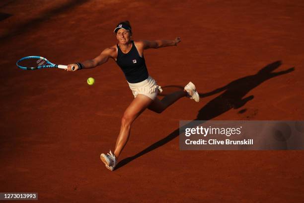 Irina-Camelia Begu of Romania stretches to play a forehand in her round two match against Johanna Konta of Great Britain during day four of the...