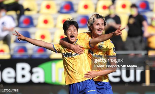 Lee Seung-Woo of STVV celebrates with Yuma Suzuki of STVV after scoring a goal during the Jupiler Pro League match between Sint-Truidense VV and...